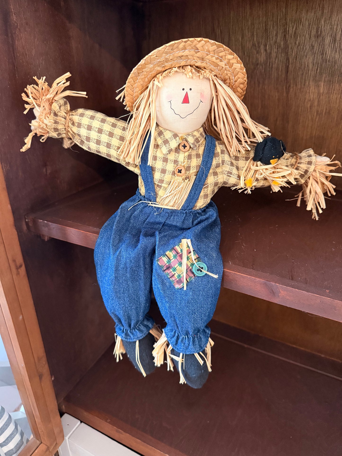 Sitting scarecrow