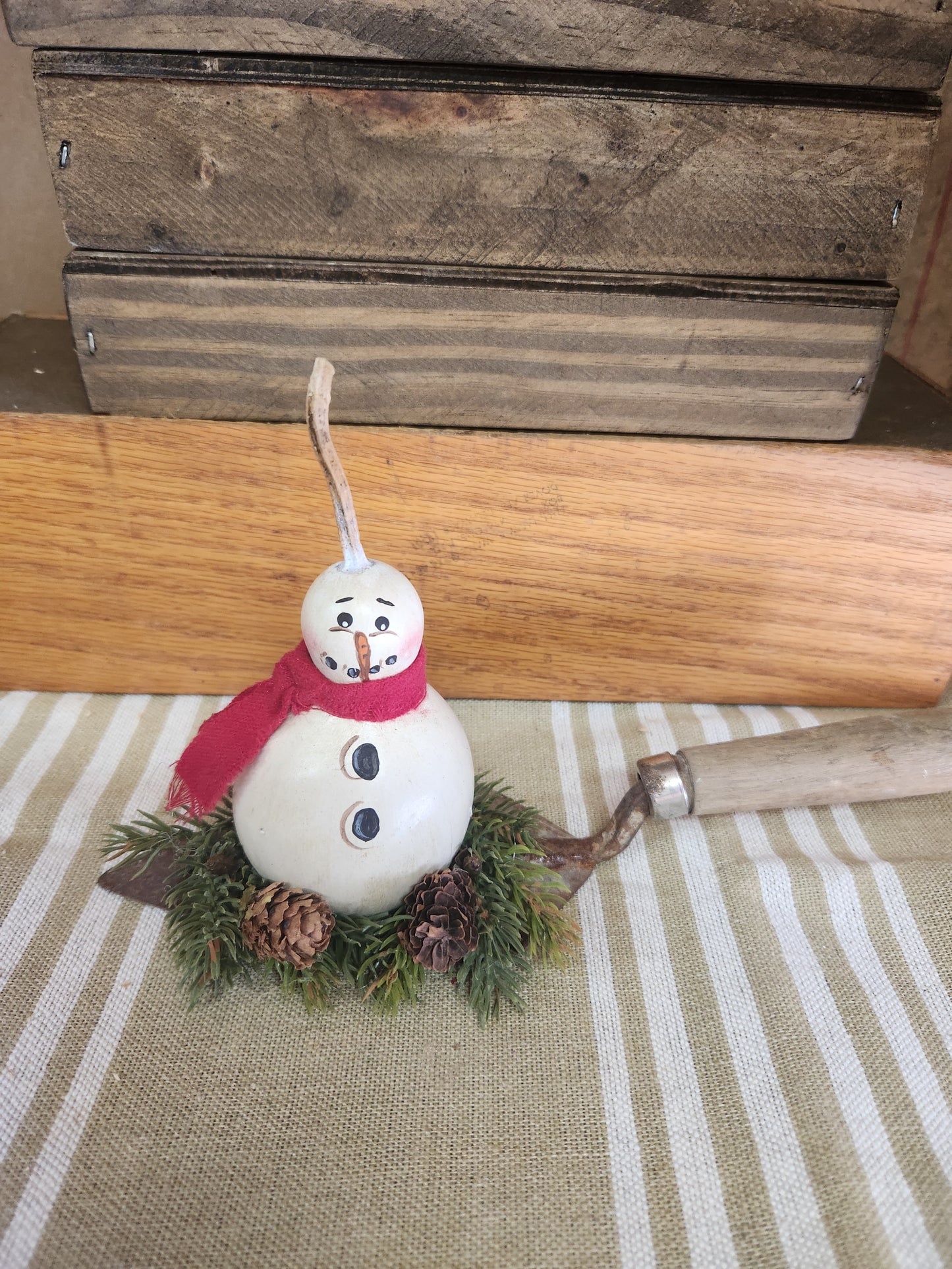 Snowman gourd on spackling tool