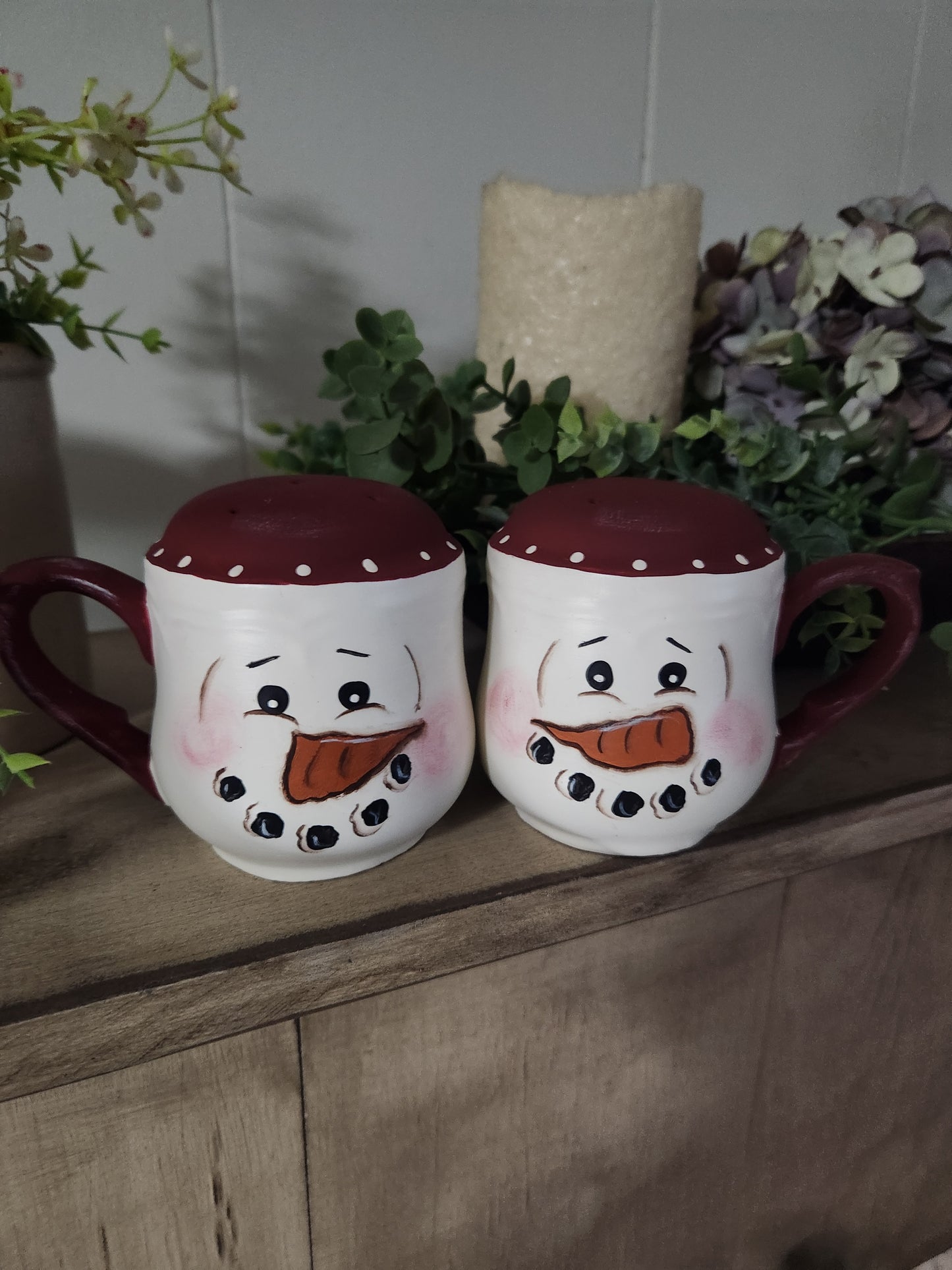 Salt and pepper shakers with handles