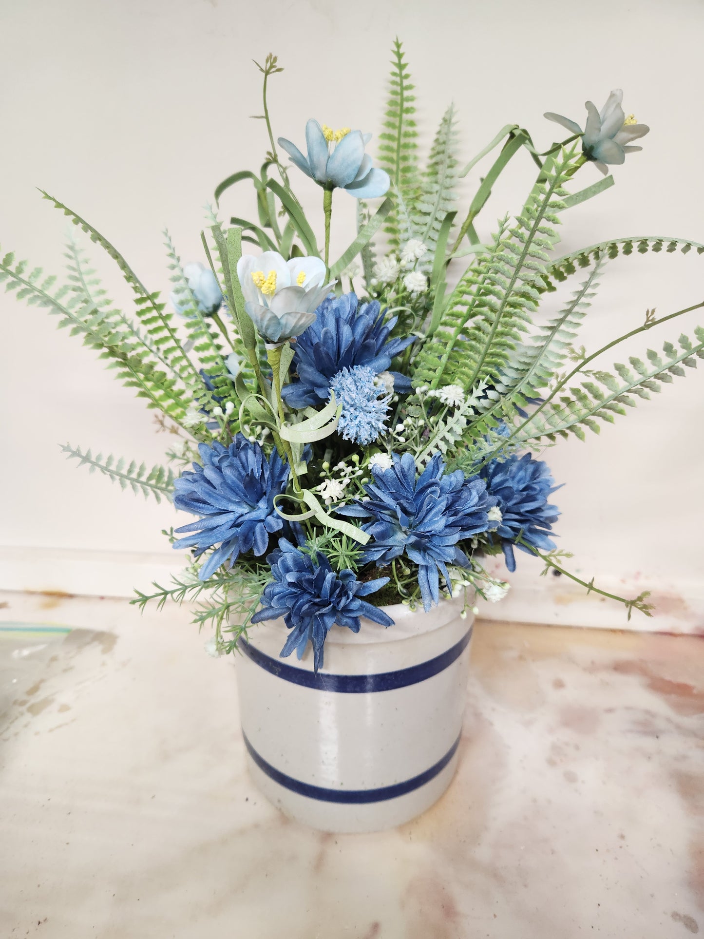 Blue arrangement in crock