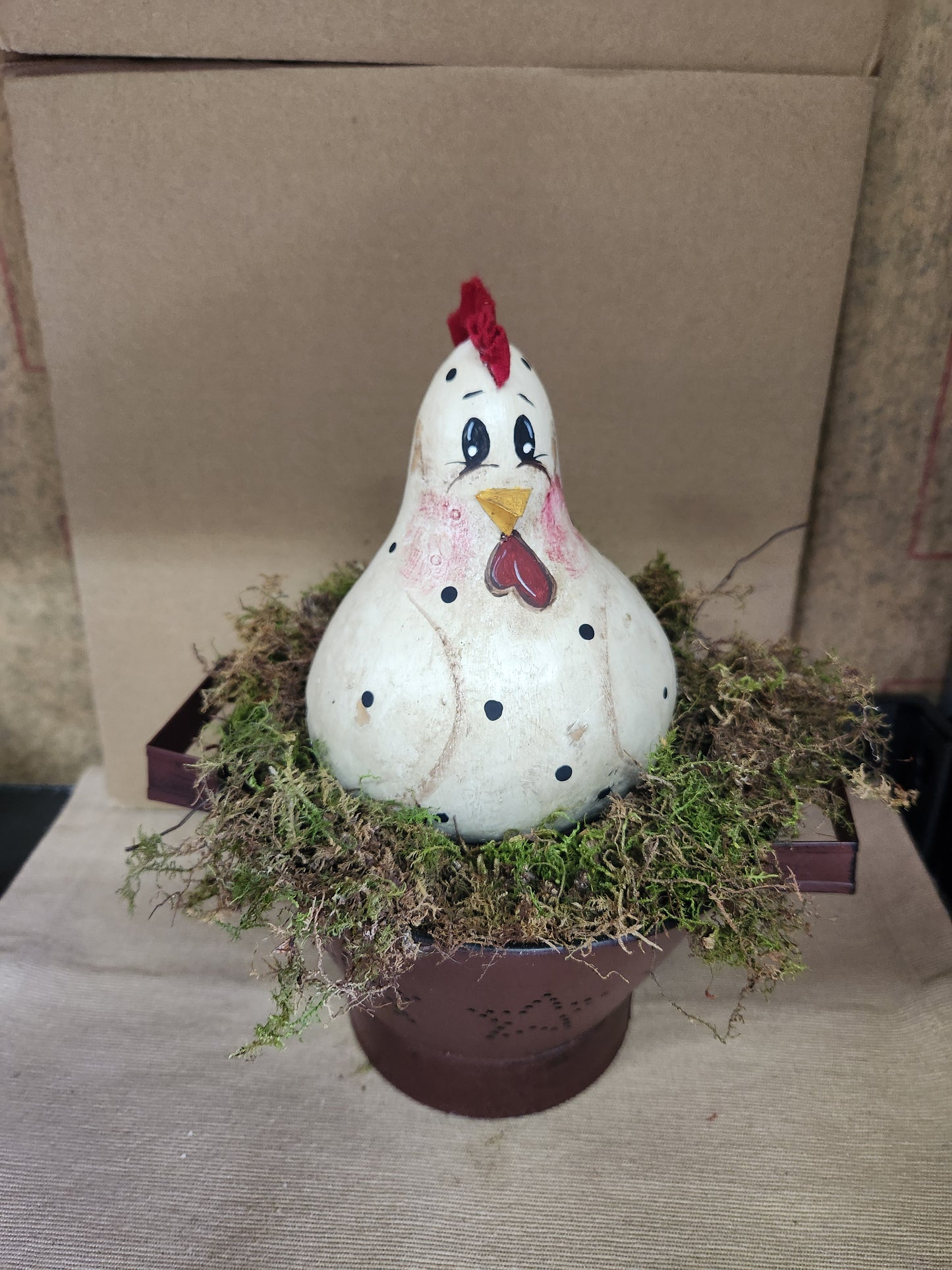 Gourd hen in colander