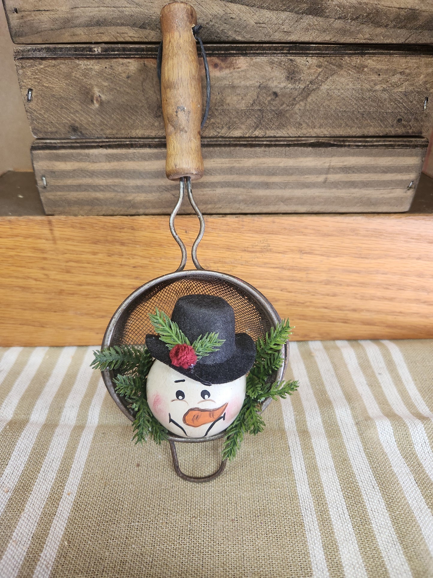 Snowman in vintage sifter