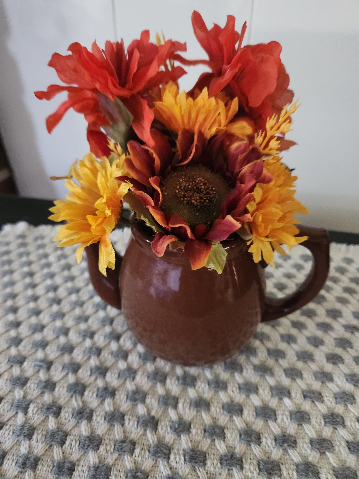 Teapot with arrangement.