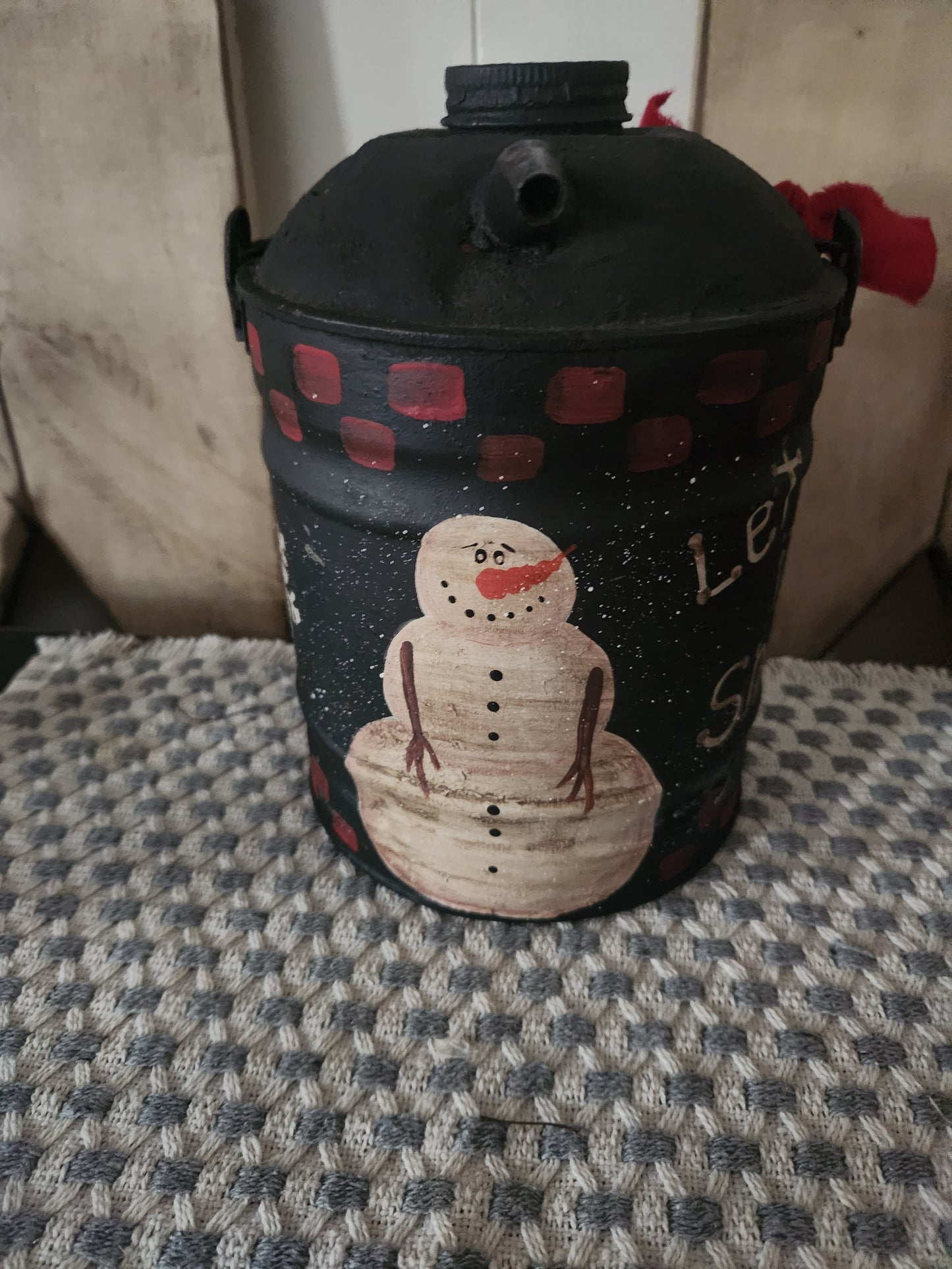 Primitive snowman gas can