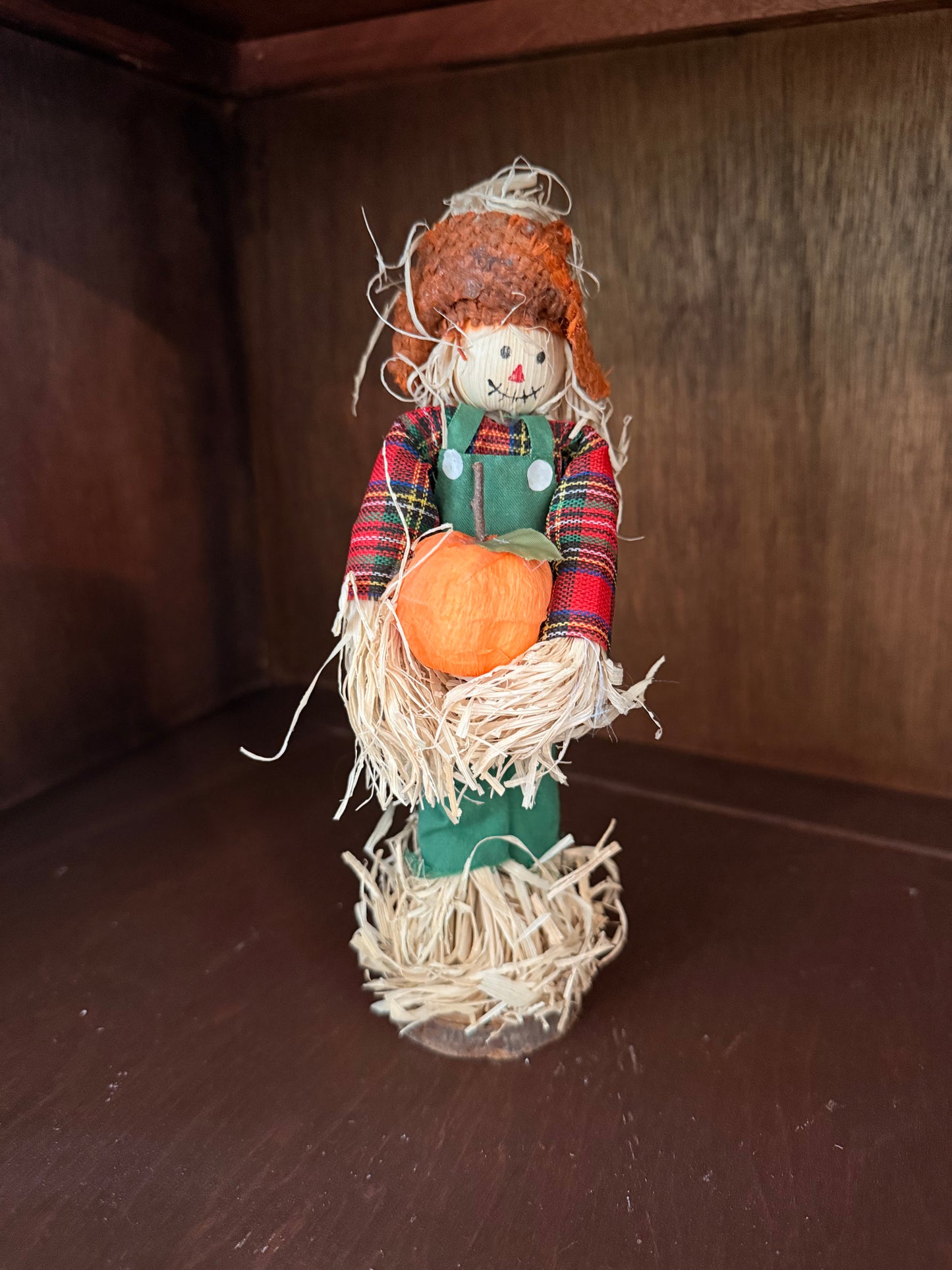 Scarecrow with pumpkin