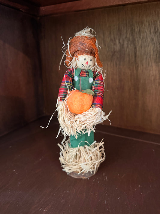 Scarecrow with pumpkin