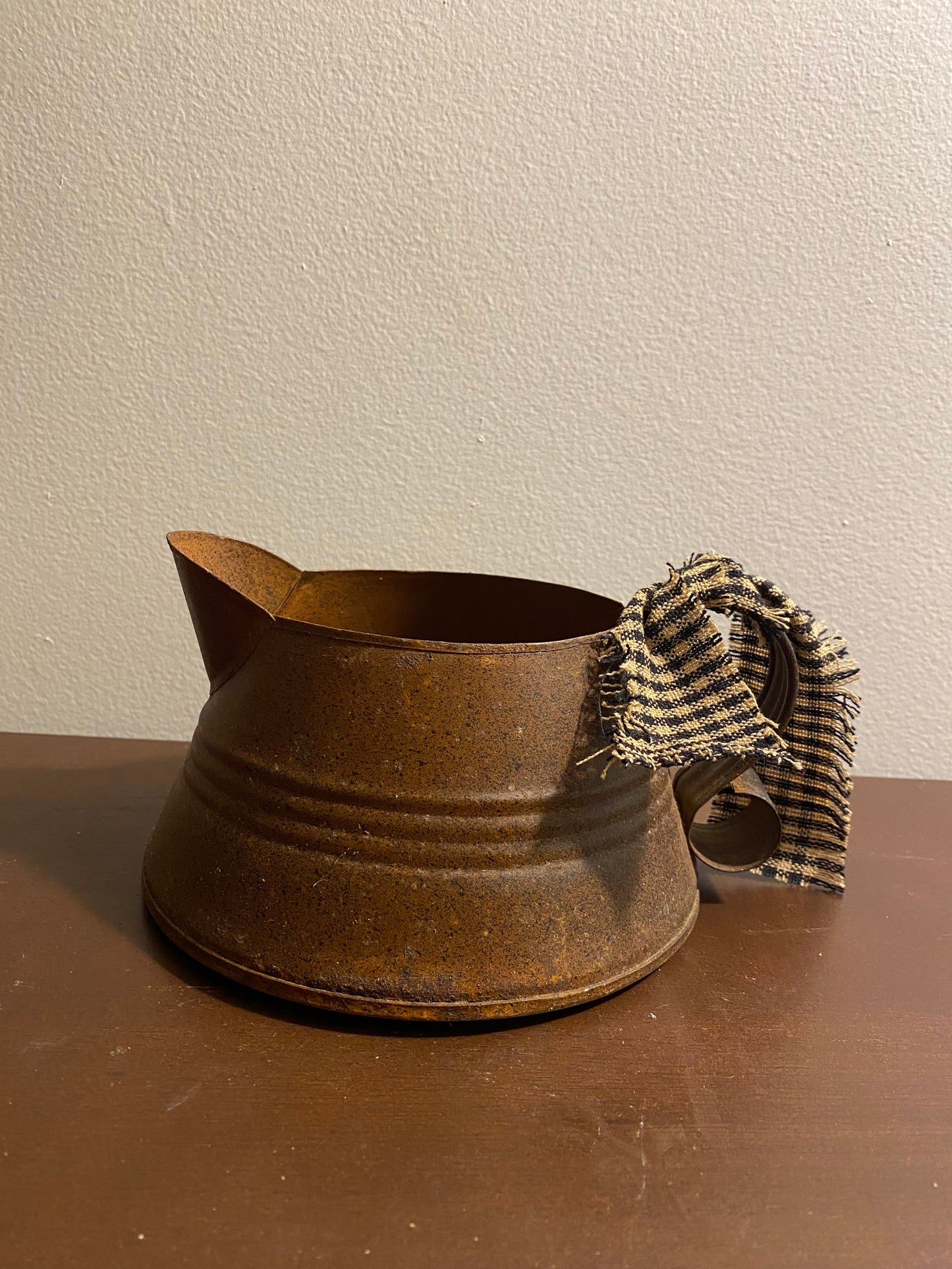 Short rusty pitcher