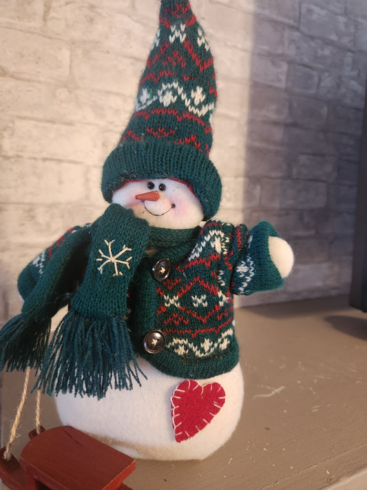 Snowman in green sweater