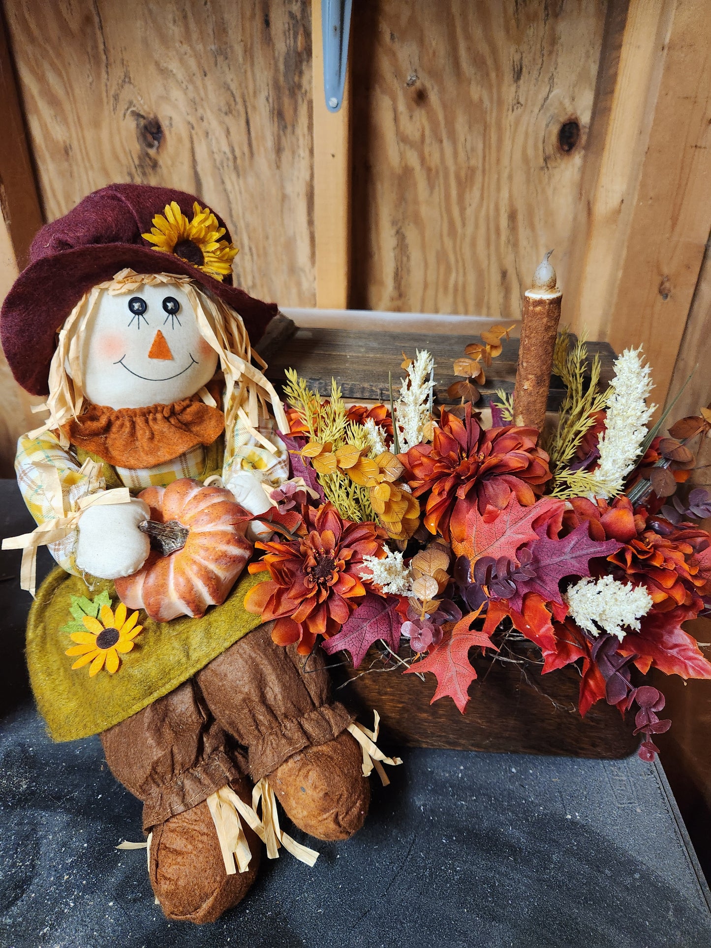 Scarecrow lady arrangement with battery operated candle