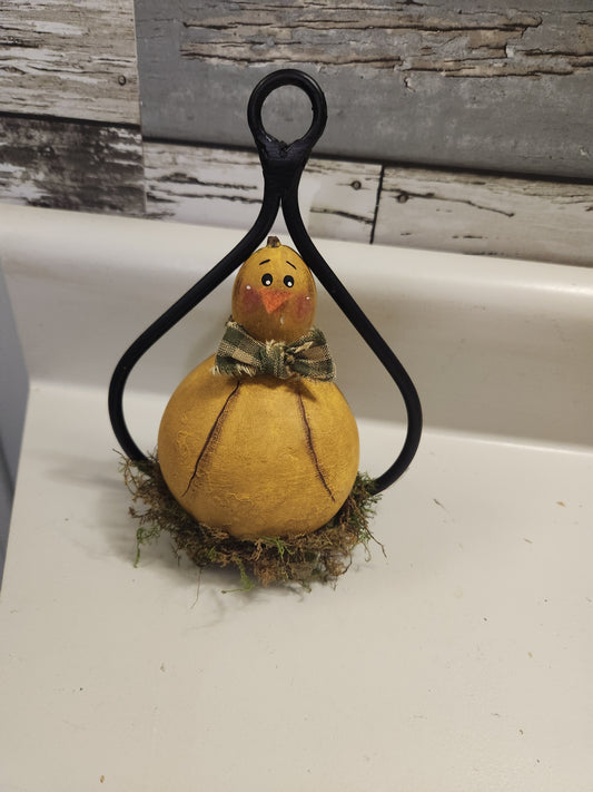 Chick gourd in wrought iron holder