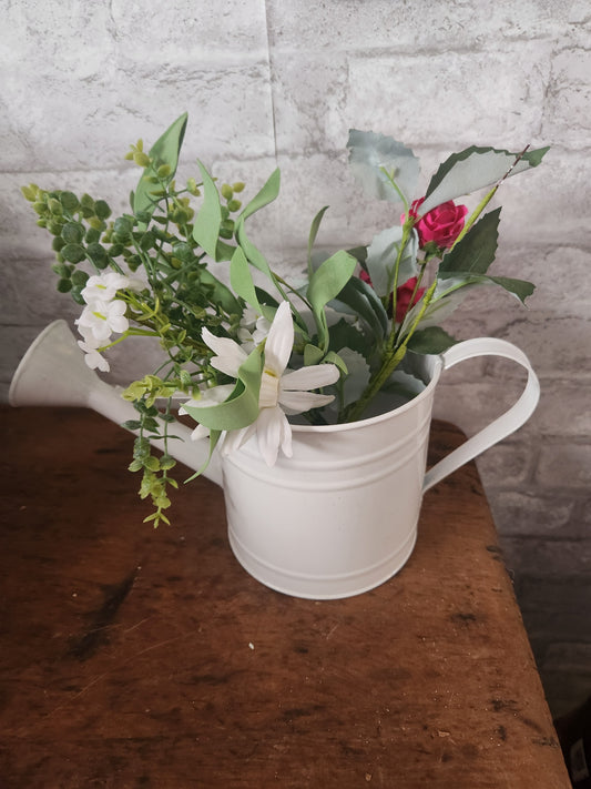 Watering can with flowers