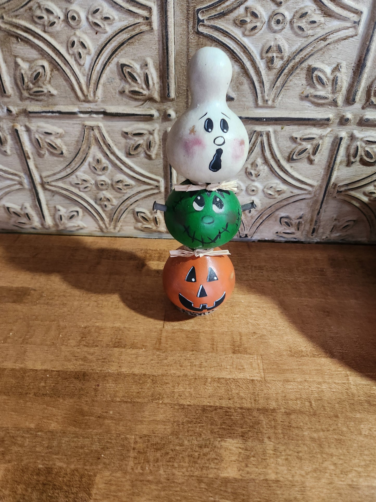 Ghost Frankenstein and jack-o-lantern gourd stack