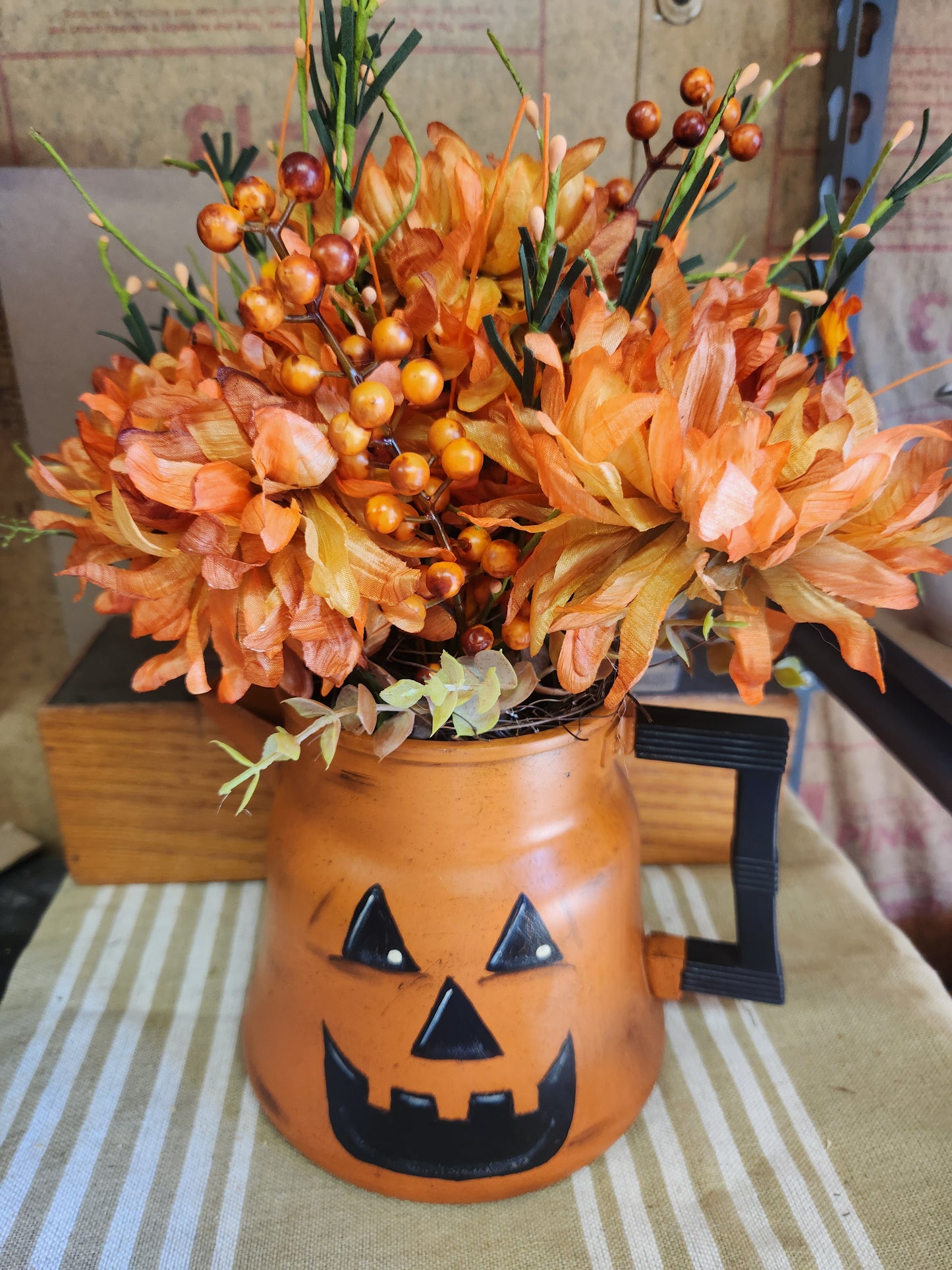 Vintage coffee pot jack-o-lantern arrangement