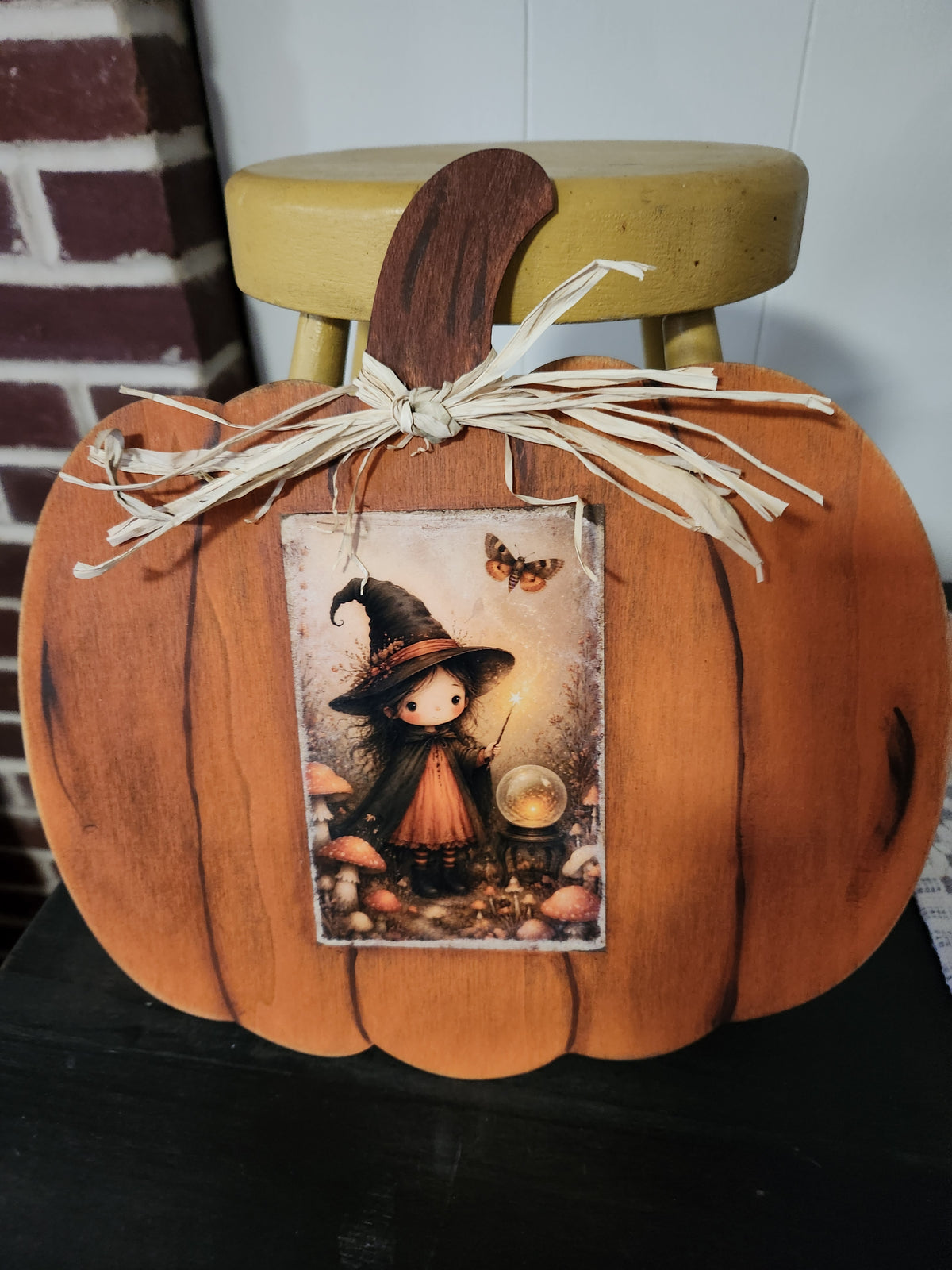 Witch with butterfly pumpkin