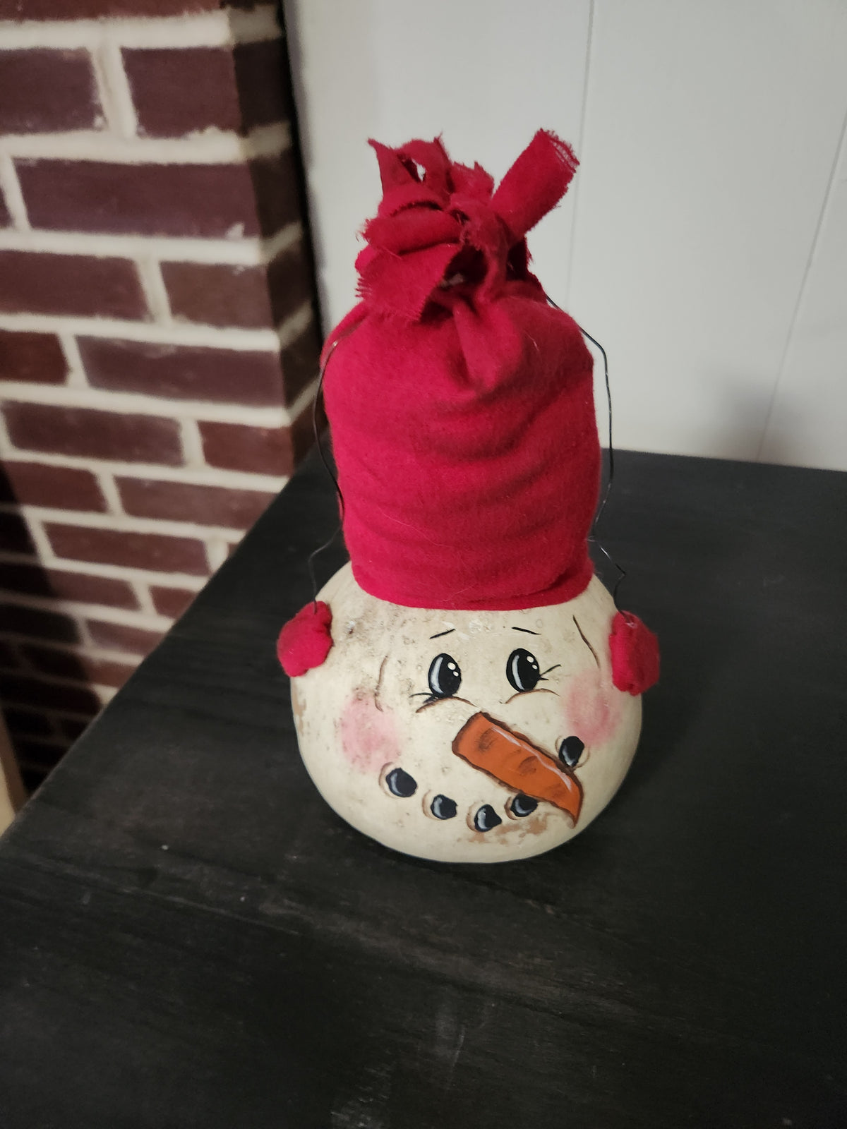 Snowman gourd with earmuffs