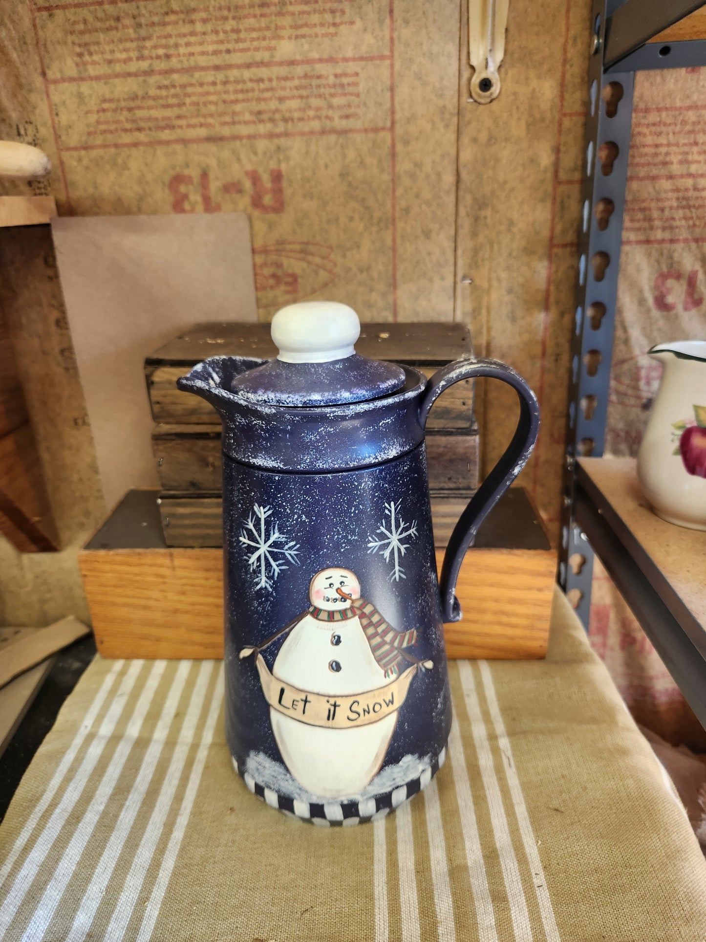 Blue carafe with snowman