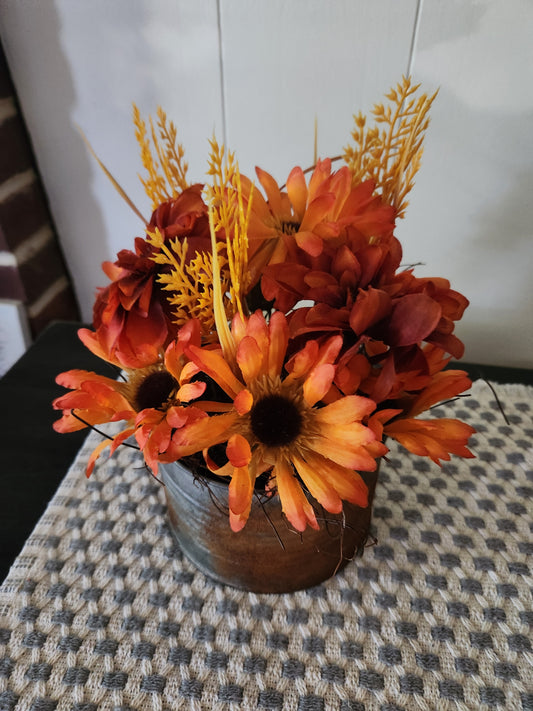 Flower arrangement in round container