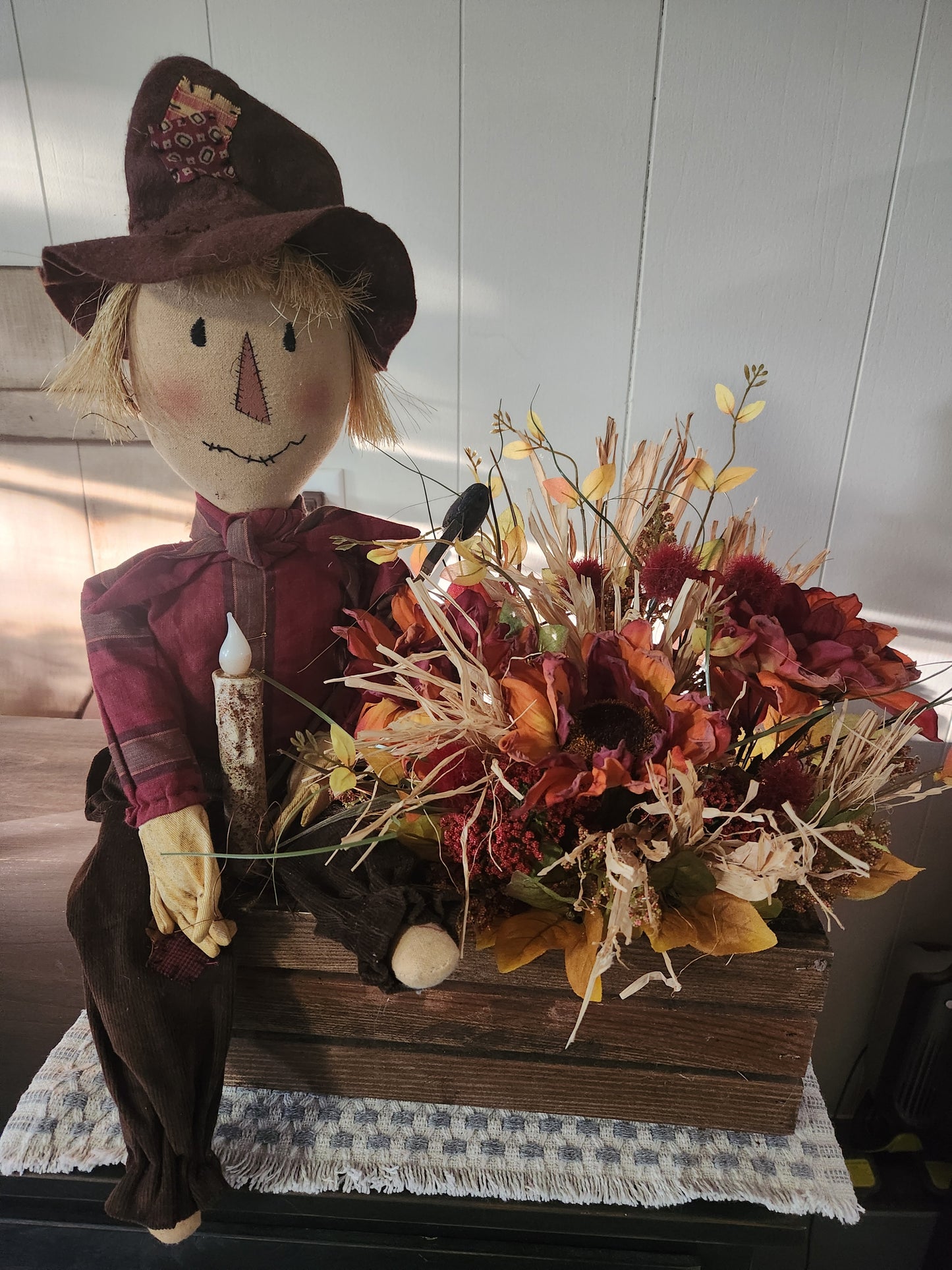 Scarecrow arrangement with timed battery operated candle