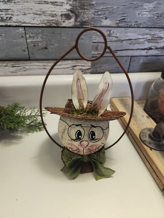 Bunny in rusty hanger