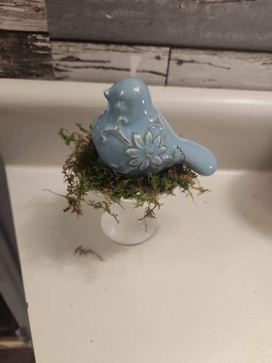 Bird on pedestal