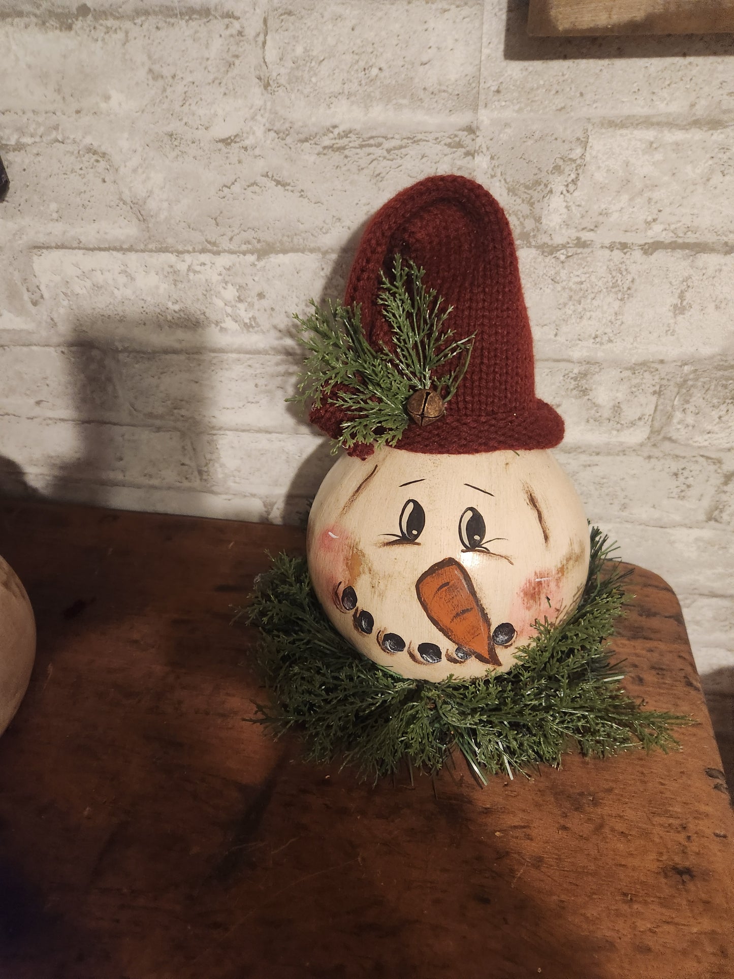 Snowman gourd with pine around bottom