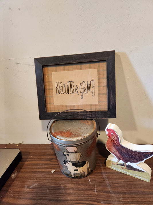 Biscuits sign and old can