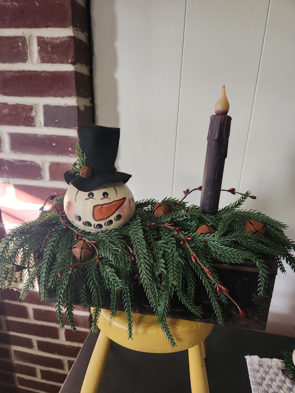 Snowman gourd arrangement on old box timed taper